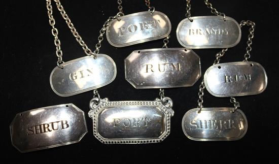 A set of 3 Scottish George IV silver spirit labels, a near pair of George III labels, a Whisky label and a pair of plated labels